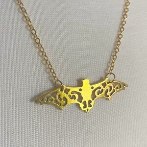 Goldtone bat filigree necklace